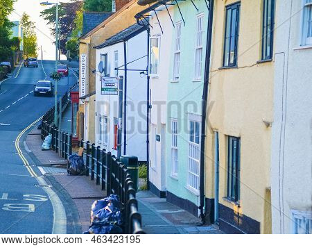 Honiton, United Kingdom - June 17 2009; Editorial - Winding Road Leading Uphill Past Terrace Style H