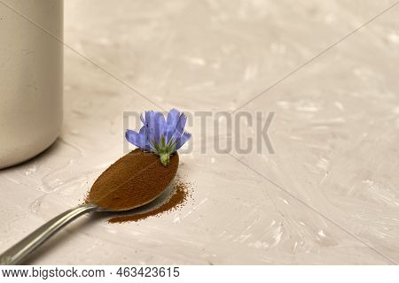 A Spoon With Chicory Flower And Chicory Powder And Chicory Flowers In A Coffee Mug
