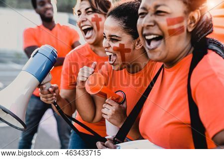 Females Football Fans Exulting While Watching Soccer Game At Stadium - Women With Painted Face And M