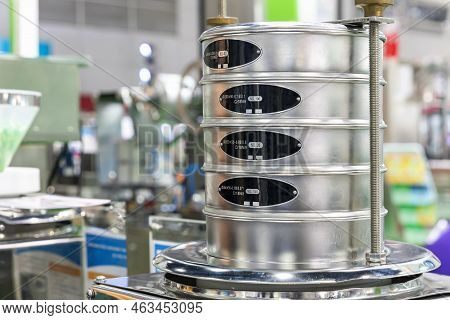 Close Up Various Particle Size Square Wire Mesh Lab Strainer Or Sand Mesh Vibration Sieve On Vibrato
