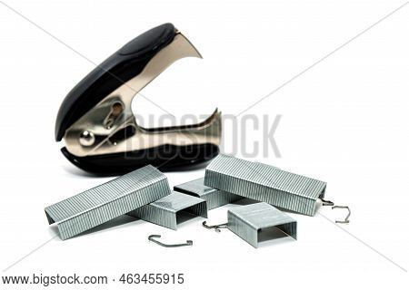 Stapler And Anti-stapler With Staples On A White Background. Office Supplies Isolate