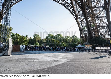 Paris, France - August 27 2022: People Queueing To Go Up The Eiffel Tower. Iron Structure Building, 