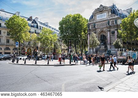 Paris, France - August 27 2022: People By The Fontaine Saint-michel Located In Place Saint-michel In