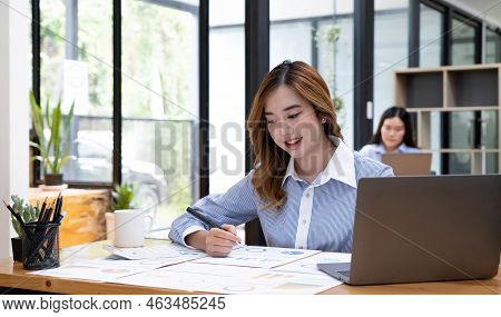 Portrait Of Smiling Beautiful Business Asian Woman Working In Office Use Computer With Copy Space. B