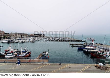 Santona, Spain - August 13, 2022: The Port With Fishing Boats A Cloudy Day. Santona Is Famous For An