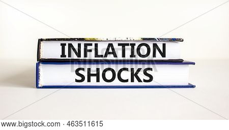Inflation Shocks Symbol. Concept Words Inflation Shocks On Books. Beautiful White Table White Backgr