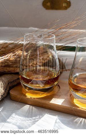Flight Of Single Malt Scotch Whisky Served On Old Wooden Window Sill In Scottisch House In Edinburgh