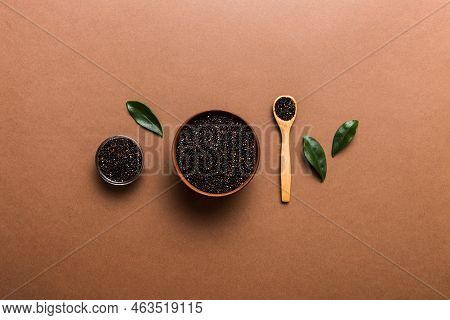 Quinoa Seeds In Bowl And Spoon On Colored Background. Healthy Kinwa In Small Bowl. Healthy Superfood