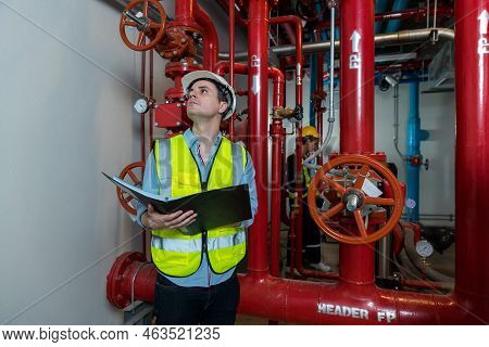 Engineer Or Technician Work Checking Fire Suppression System And Fire Equipment. Engineer Check Red 