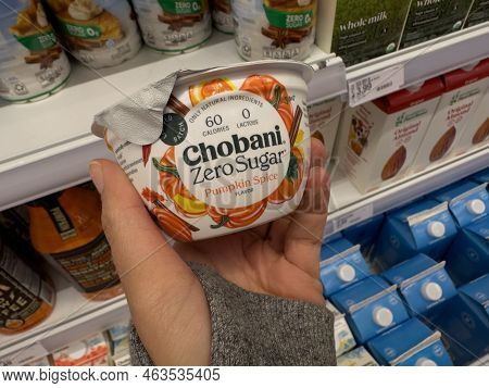 Plymouth, Minnesota - October 8, 2022: Hand Holds Up A Container Of Chobani Zero Sugar Pumpkin Spice