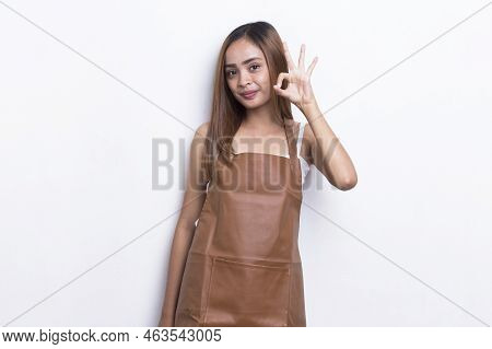 Asian Woman Barista Waitress Wearing Apron With Ok Sign Gesture Tumb Up Isolated On White Background