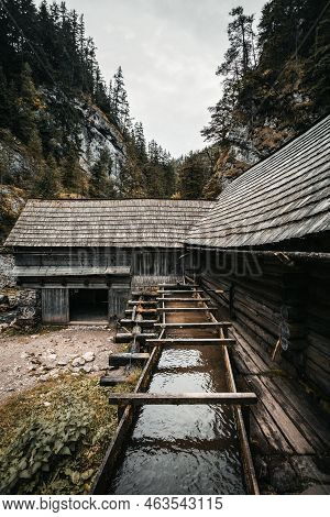 Vertical Photo Of A Beautiful Wooden Cabin Deep In The Forest - Mlyny Oblazy (slovakia). Old Wooden 