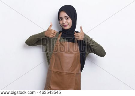 Asian Muslim Woman Barista Waitress Wearing Apron With Ok Sign Gesture Tumb Up Isolated On White Bac