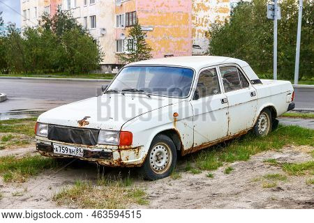Novyy Urengoy, Russia - August 26, 2022: Rusty Abandoned Motor Car Gaz-31029 Volga In The City Stree