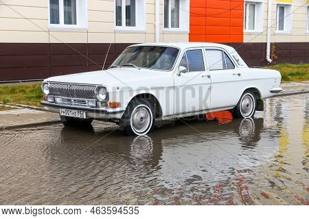 Pangody, Russia - September 4, 2022: Classic Soviet Saloon Car Gaz-24 Volga In The Town Street.