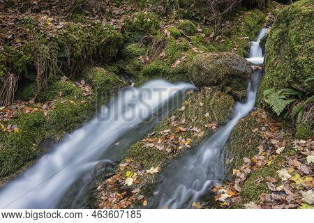 Beautiful Waterfall Landscape Image In Vibrant Autumn Woodland In Lake District