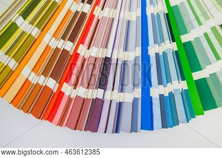 Color Guide Close Up. Assortment Of Colors For Design. Colors Palette Fan On White Concrete Wall Bac