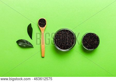 Quinoa Seeds In Bowl And Spoon On Colored Background. Healthy Kinwa In Small Bowl. Healthy Superfood