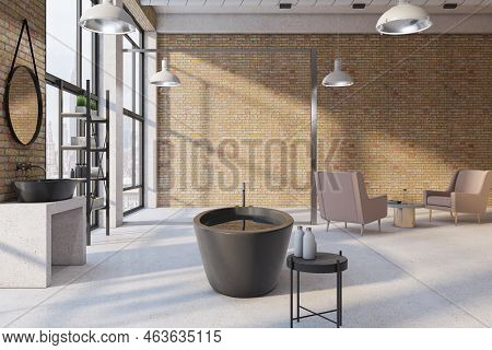 Side View On Black Stylish Bath In Sunlit Spacious Loft Style Bathroom With Brick Wall, Armchairs On