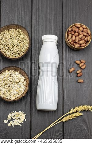 Ingredients For Breakfast. Milk Bottle And Uncooked Oatmeal. Sprigs Of Wheat And Grains Of Wheat In 