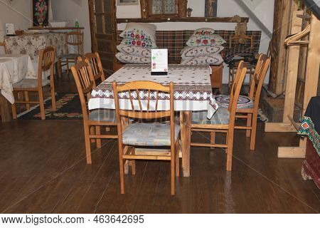 Orheiul Vechi, Moldova - June 14, 2021 - A Traditional Restaurant Set Up With A Table And Chairs Ins
