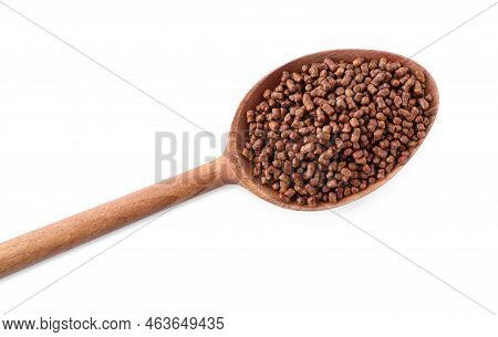 Wooden Spoon With Buckwheat Tea Granules On White Background, Top View