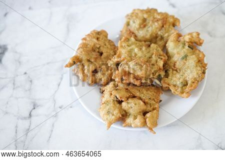 Bakwan Goreng, Fried Food, Indonesian Traditional Street Food Snacks. Fried Vegetables Dough Fritter
