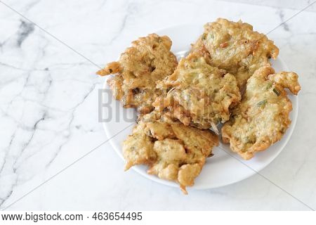 Bakwan Goreng, Fried Food, Indonesian Traditional Street Food Snacks. Fried Vegetables Dough Fritter