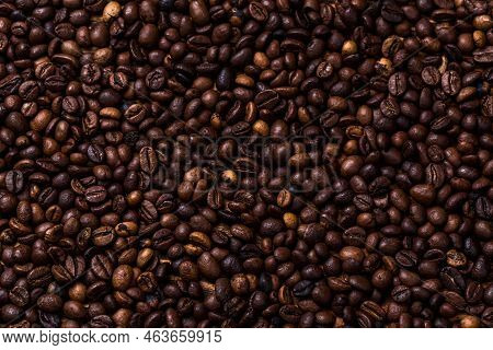 Fried Coffee Beans. Coffee Beans, On A Wooden Background