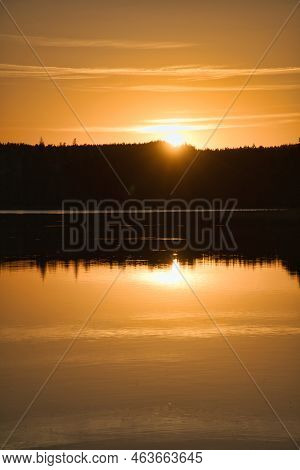 Sunset With Reflection On A Swedish Lake In Smalland. Romantic Evening Mood. Landscape Shot From Sca