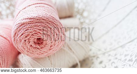 Handmade Macrame Braiding And Cotton Threads In White Basket. Cotton Macrame Cords And Ropes Against