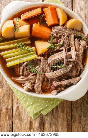 Slowly Cooked Pulled Beef With Potatoes, Onions, Carrots, Celery In A Spicy Sauce Close-up In A Fryi