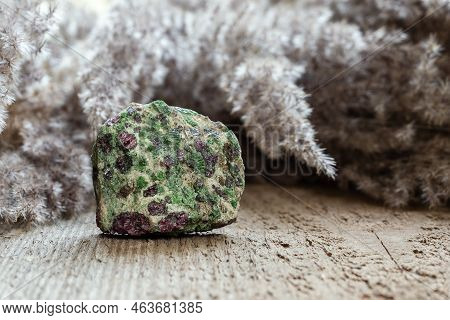 Eclogite Rock Containing Green Pyroxene And Red Garnet Or Pyrope On Wooden Natural Background With C