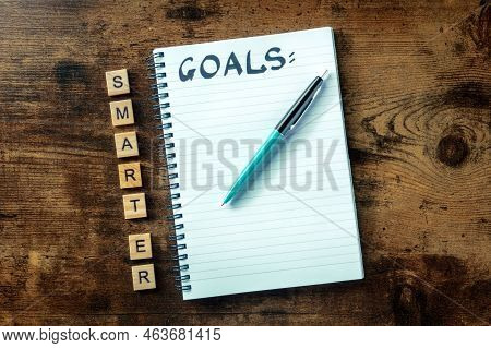 Smarter Goals Concept, A Notepad With The Handwritten Word, Ready For Writing A List Or A Plan, Top 