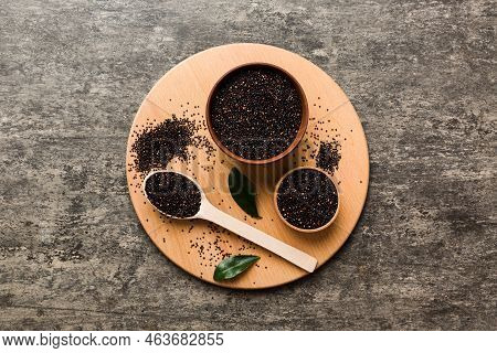 Quinoa Seeds In Bowl And Spoon On Colored Background. Healthy Kinwa In Small Bowl. Healthy Superfood