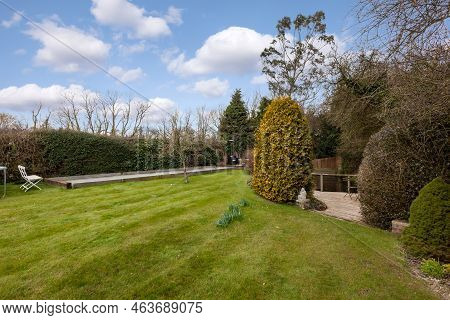 Stradishall, England - March 21 2016: Landscaped Cottage Garden With Lawn And Petanque Court