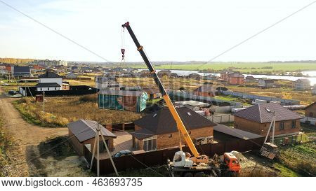 The Crane Sets The Bathhouse On The Territory. Delivery And Installation Of A Turnkey Bath. The Cran