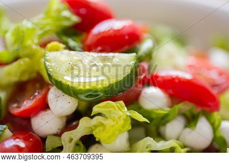 Fresh Lettuce Macro Shot. Salad With Baby Mozzarella Cherry Leaves Iceberg. Olive Oil In Salad. Sala