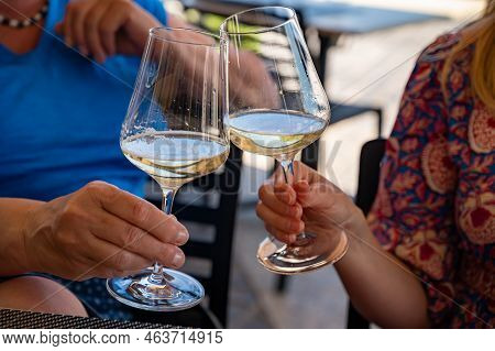 Drinking Of Txakoli Or Chacolí Slightly Sparkling Very Dry White Wine Produced In Spanish Basque Cou