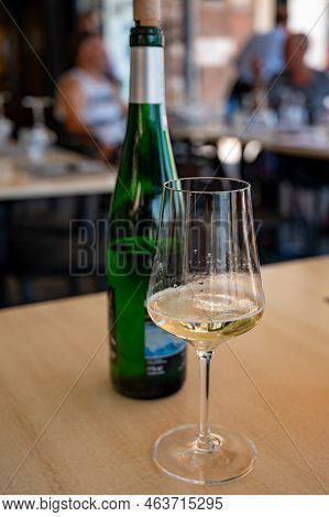 Drinking Of Txakoli Or Chacolí Slightly Sparkling Very Dry White Wine Produced In Spanish Basque Cou