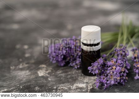 Aromatherapy Tools, Oil Bottles And Lavender Flowers. Bottle Of Essential Oil And Lavender Flowers O