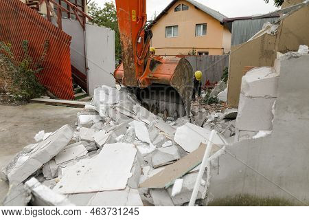 Details With An Excavator Bucket (scoop) Used To Demolish An Aac Small Building.