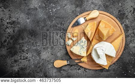 Parmesan. Cheeses Set Dor Blu Chedar Camamber Brie. Different Types Of Cheese With Knife On A Dark B