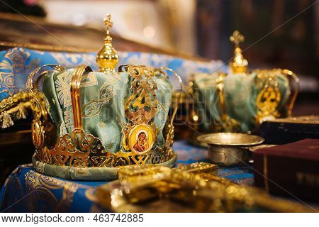 Orthodox Church Wedding Ceremony. Traditional Wedding Accessories. Bestman Hold The Crown Over Bride