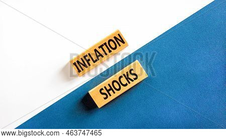 Inflation Shocks Symbol. Concept Words Inflation Shocks On Wooden Blocks. Beautiful White And Blue B
