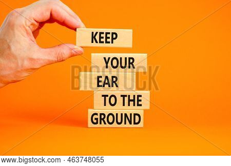 Keep Your Ear To The Ground Symbol. Concept Words Keep Your Ear On The Ground On Wooden Blocks. Busi