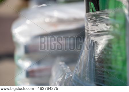 Selective Focus On Cellophane Shrink Wrap On Pallets Of Goods For Transport.