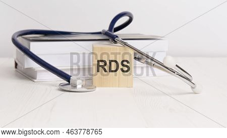 The Word Rds Is Written On Wooden Cubes Near A Stethoscope On A White Background.