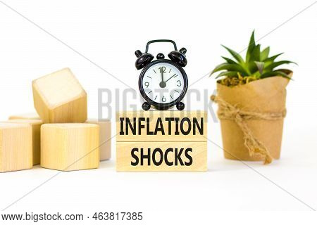 Inflation Shocks Symbol. Concept Words Inflation Shocks On Wooden Blocks. Beautiful White Table Whit