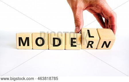 Modern Model Symbol. Businessman Turns Wooden Cubes And Changes The Word 'model' To 'modern'. Beauti